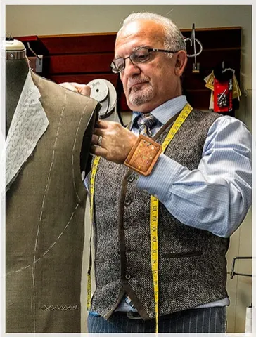 The tailor at Kachins Tailors at work in the shop